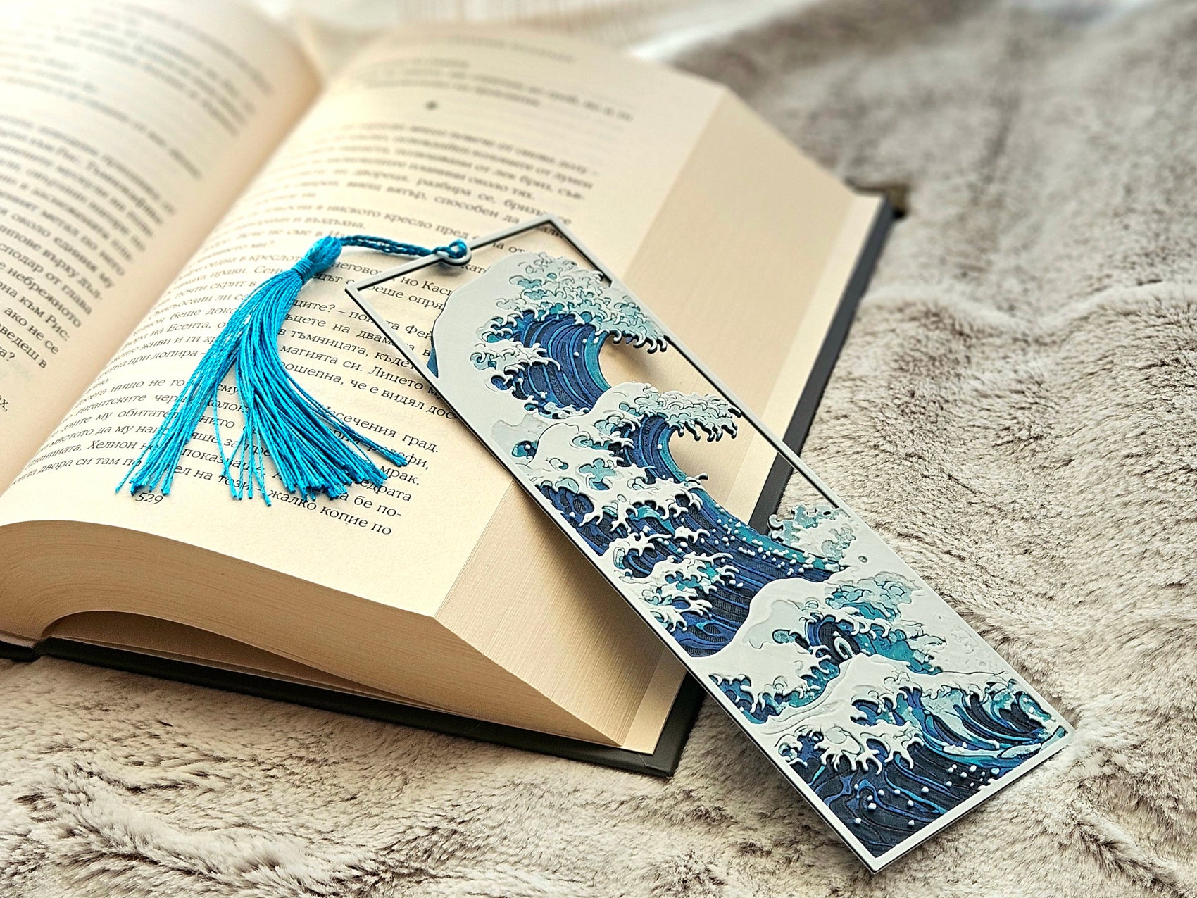 Bookmark with wave design on an open book