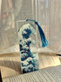 Decorative bookmark with wave design on an open book